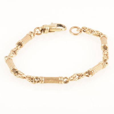 Lot 254 - A 9 carat gold barrel link chain bracelet.