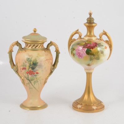 Lot 73 - Two Royal Worcester blush ivory vases and covers