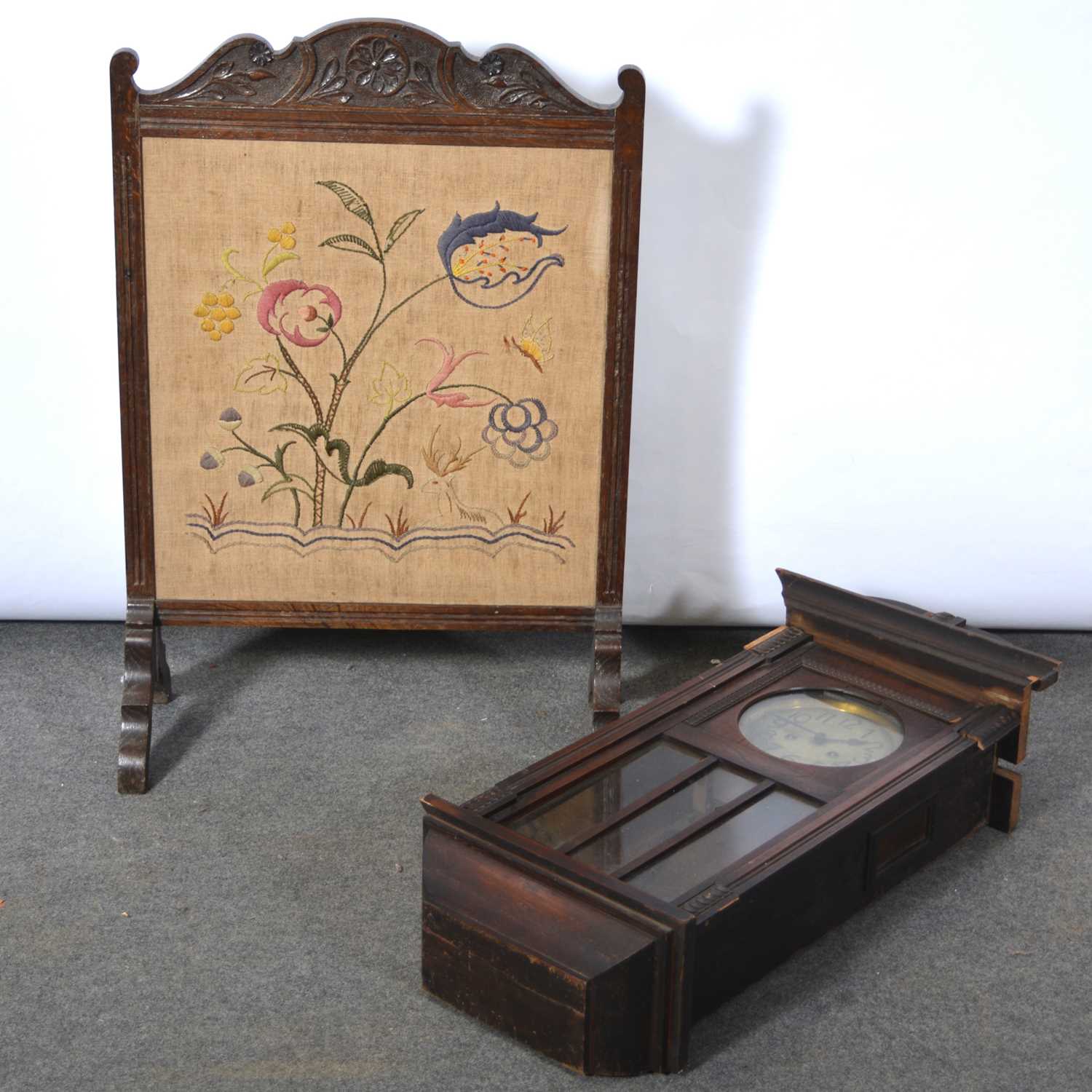 Lot 477 - Oak wall clock and a firescreen