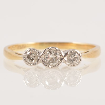 Lot 227 - A diamond three stone ring.