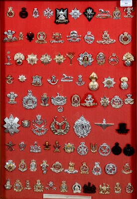 Lot 303 - Display case of replica Cap Badges of The Regiments & Corps of The British Army 1983, 1973 bugle.