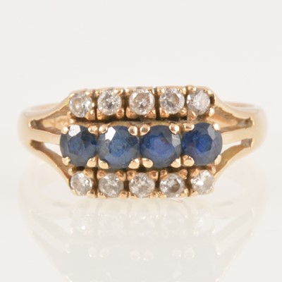 Lot 233 - A sapphire and diamond three row ring.