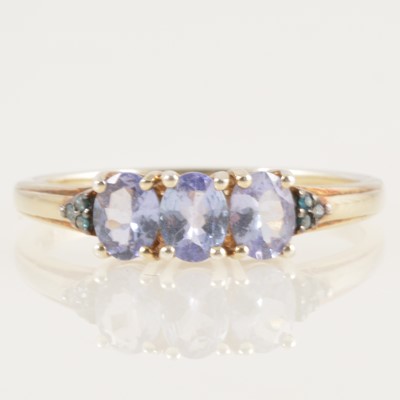 Lot 235 - A tanzanite and diamond ring.