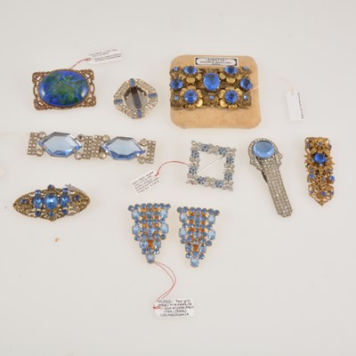 Lot 291 - Brooches, dress clips and a buckle set with blue paste.