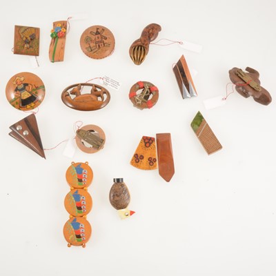 Lot 300 - Sixteen vintage wooden and composite dress clips, brooches and bracelet.