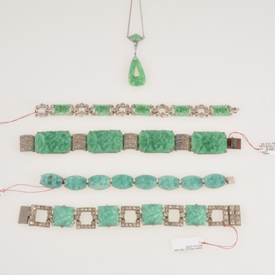 Lot 312 - Four simulated jade panel bracelets and a similar pendant with integral chain.