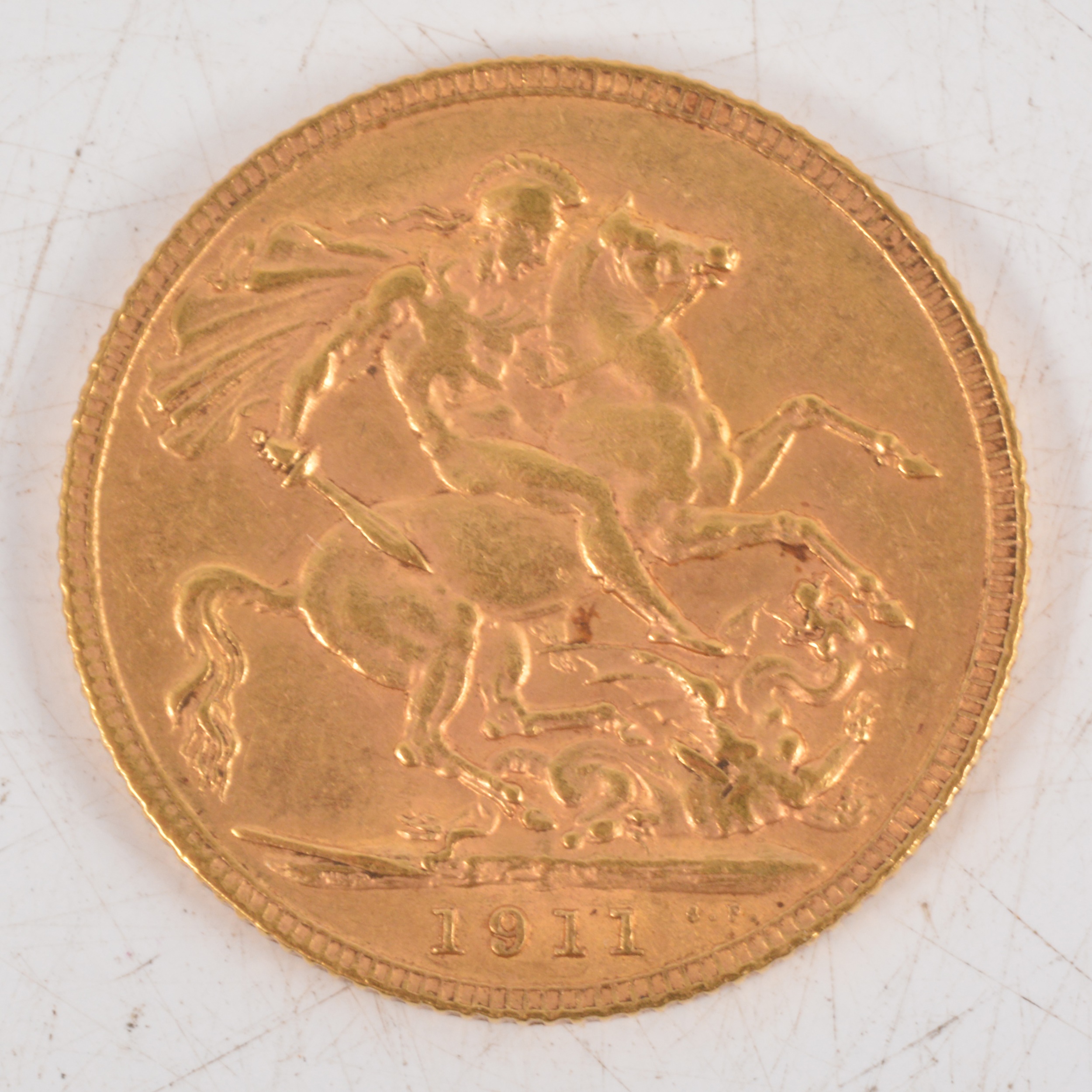 Lot 201 - George V gold Sovereign coin, 1911, 8g.