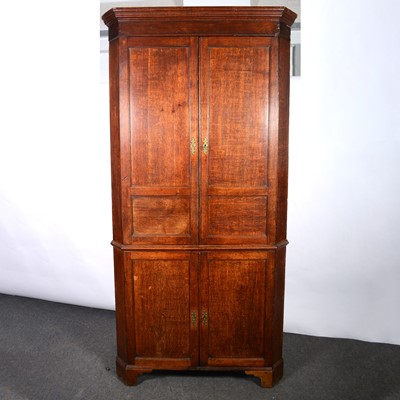 Lot 457 - Large late Georgian oak freestanding corner cupboard