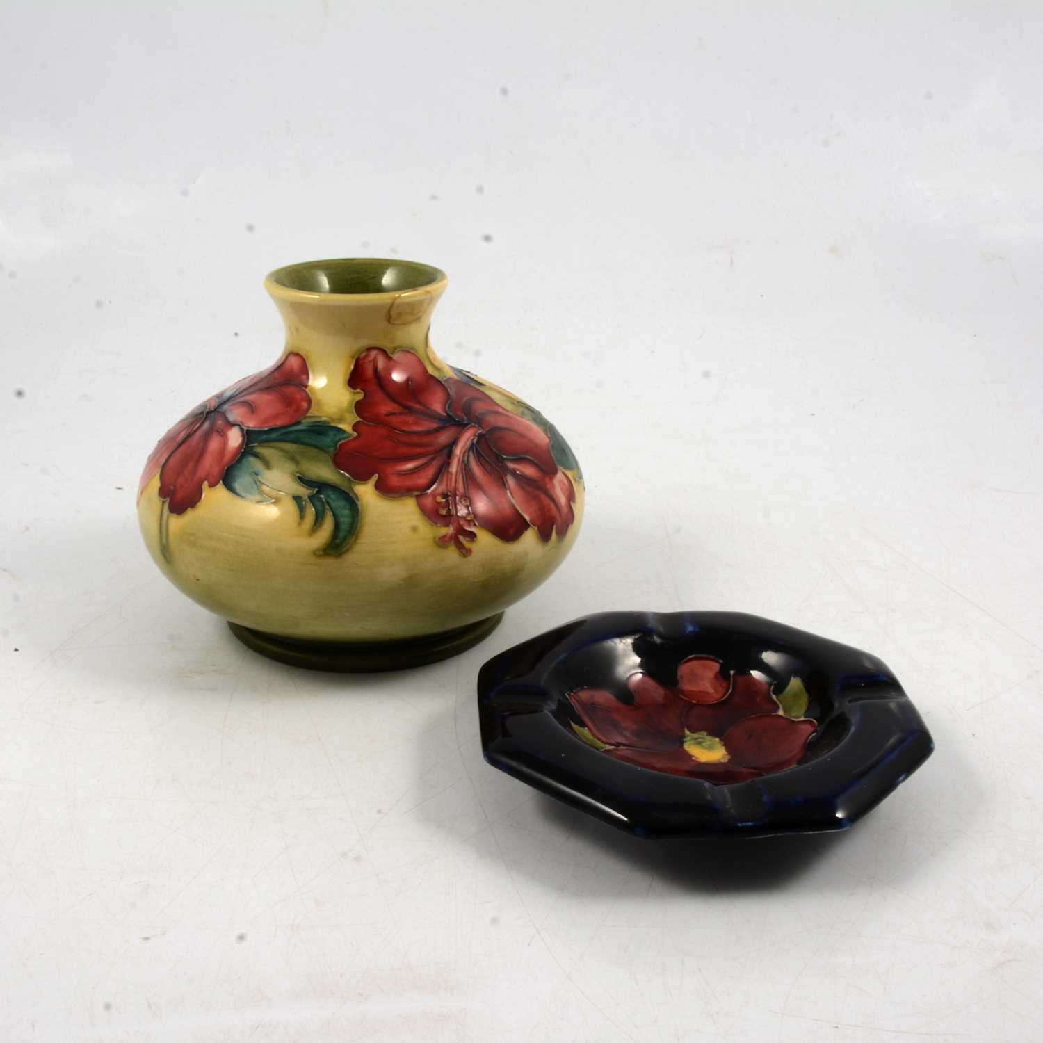 Lot 39 - Moorcroft Pottery, Hibiscus pattern squat vase, and a small ashtray dish