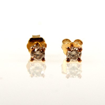 Lot 249 - A pair of small diamond earstuds.