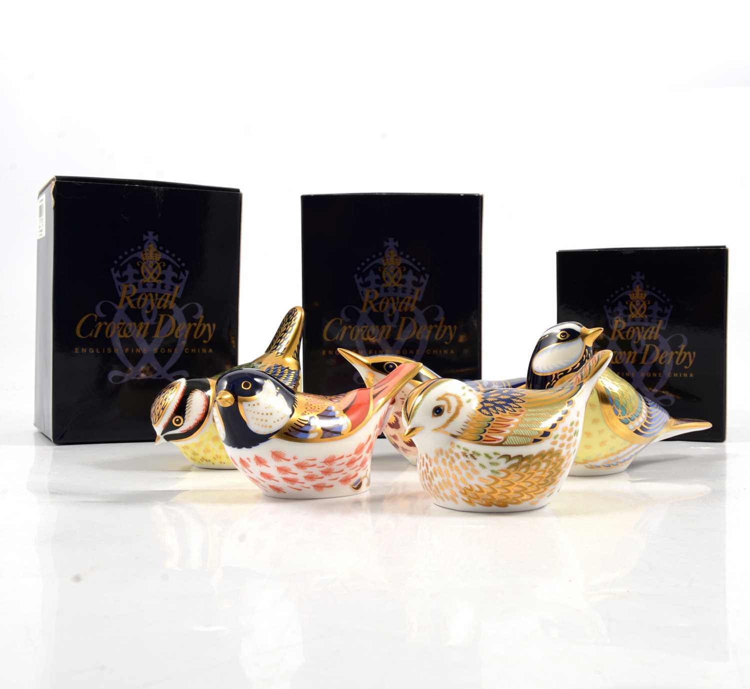 Lot 5 - Five Royal Crown Derby bird paperweights, gold stoppers.