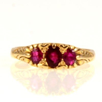 Lot 233 - A reproduction  Victorian style synthetic ruby carved claw ring
