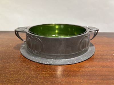 Lot 120 - Archibald Knox for Liberty & Co, a Tudric pewter dish and glass liner