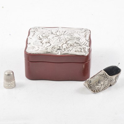 Lot 177 - Red leather trinket box with silver mount to lid, silver thimble and white metal pin cushion.