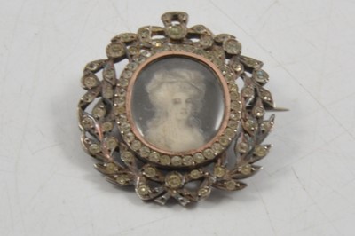 Lot 296 - A paste set brooch with portrait miniature of a Georgian lady to centre, testing as silver.