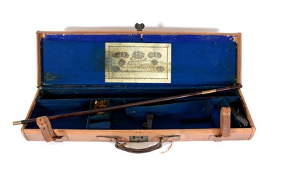 Lot 302 - James Lang tan leather gun case with cleaning rod.