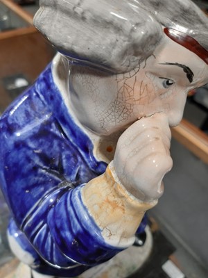 Lot 25 - A 19th century snuff taking standing man toby jug with hat.