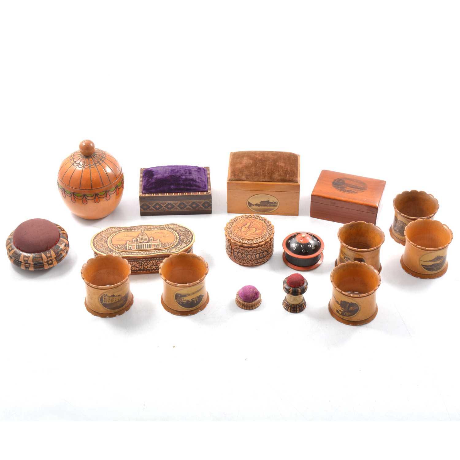 Lot 17 - Mauchline ware boxes, napkin rings, marquetry pin cushions, and other wooden items.