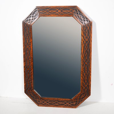 Lot 572 - Rectangular bevelled glass wall mirror in carved oak frame with canted corners.