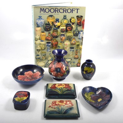 Lot 52 - Seven pieces of Moorcroft Pottery and a book.