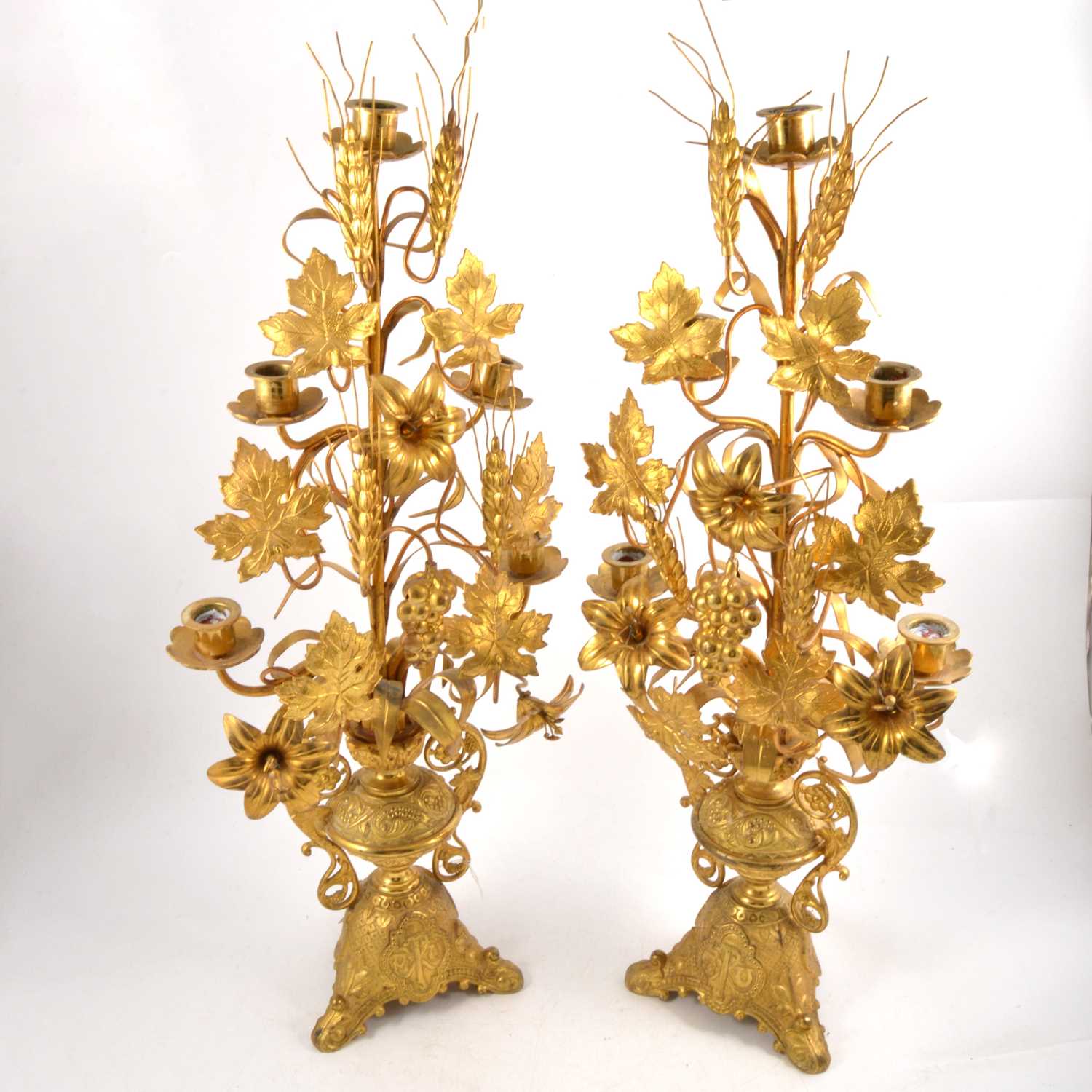 Lot 161 - Pair of gilt metal ornate altar candelabra with harvest motif.
