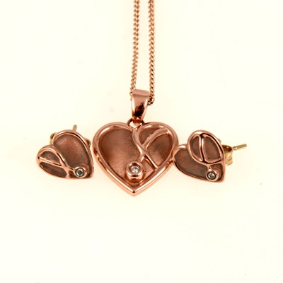 Lot 260 - Clogau Welsh gold diamond set heart shaped pendant and earstuds.