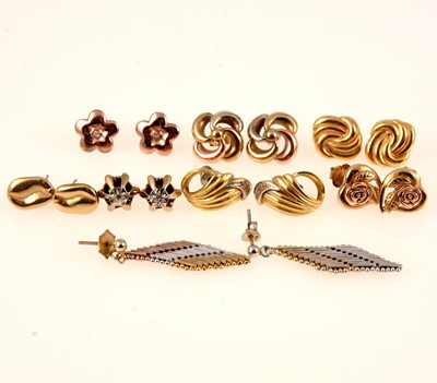 Lot 251 - Eight pairs of 9 carat gold and silver earrings for pierced ears.