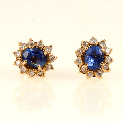 Lot 247 - A pair of sapphire and diamond oval cluster earstuds.