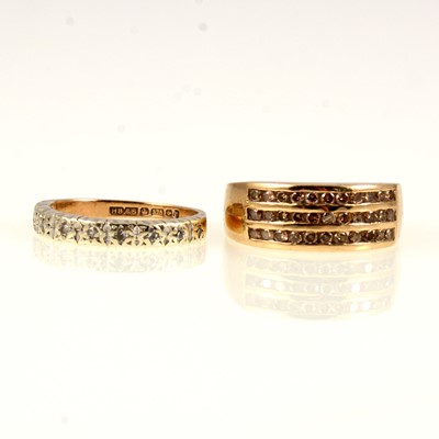 Lot 238 - Two diamond half hoop rings.