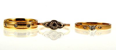 Lot 239 - Three diamond set rings.