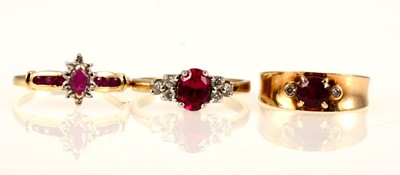 Lot 240 - Two ruby and diamond rings, and a pink and white stone ring.