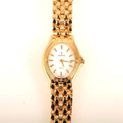 Lot 115 - Festina - a lady's gold bracelet watch.