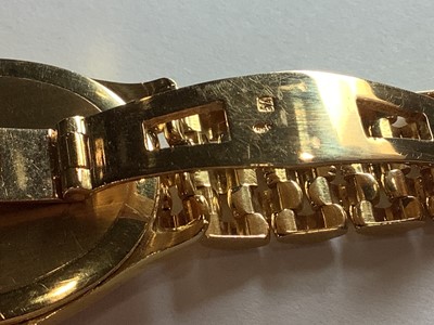 Lot 115 - Festina - a lady's gold bracelet watch.
