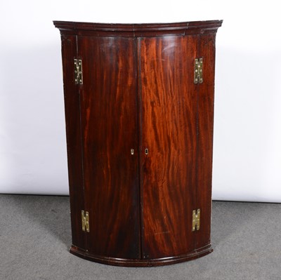 Lot 439 - George III mahogany cylinder front hanging corner cupboard