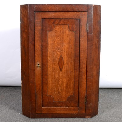 Lot 388 - Late Georgian oak and mahogany hanging corner cupboard