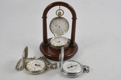 Lot 351 - Four pocket watches and stand .