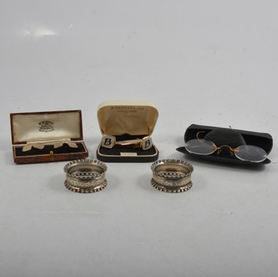 Lot 302 - Silver cufflinks, napkin rings, sugar tongs, and other small silver and plated items.