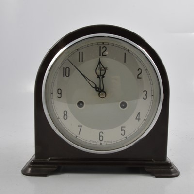 Lot 182 - A brown bakelite twin train mantel clock.