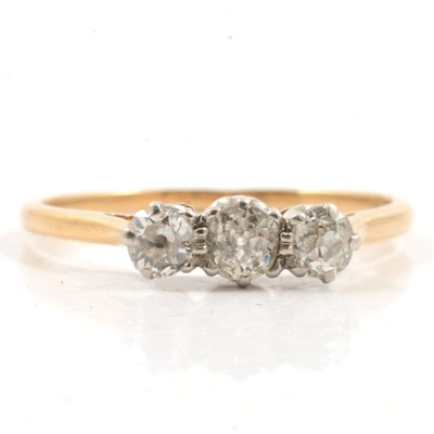 Lot 307 - A diamond three stone ring.