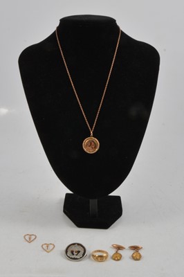 Lot 283 - An Anzac brooch, 18 carat gold ring, locket and chain, metal cufflinks.