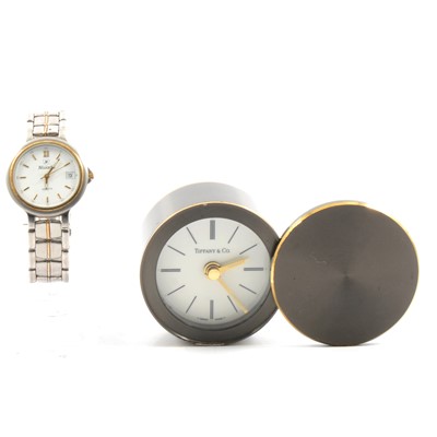 Lot 273 - A Tiffany & Co small bedside clock and a Nivada lady's quartz wrist watch.