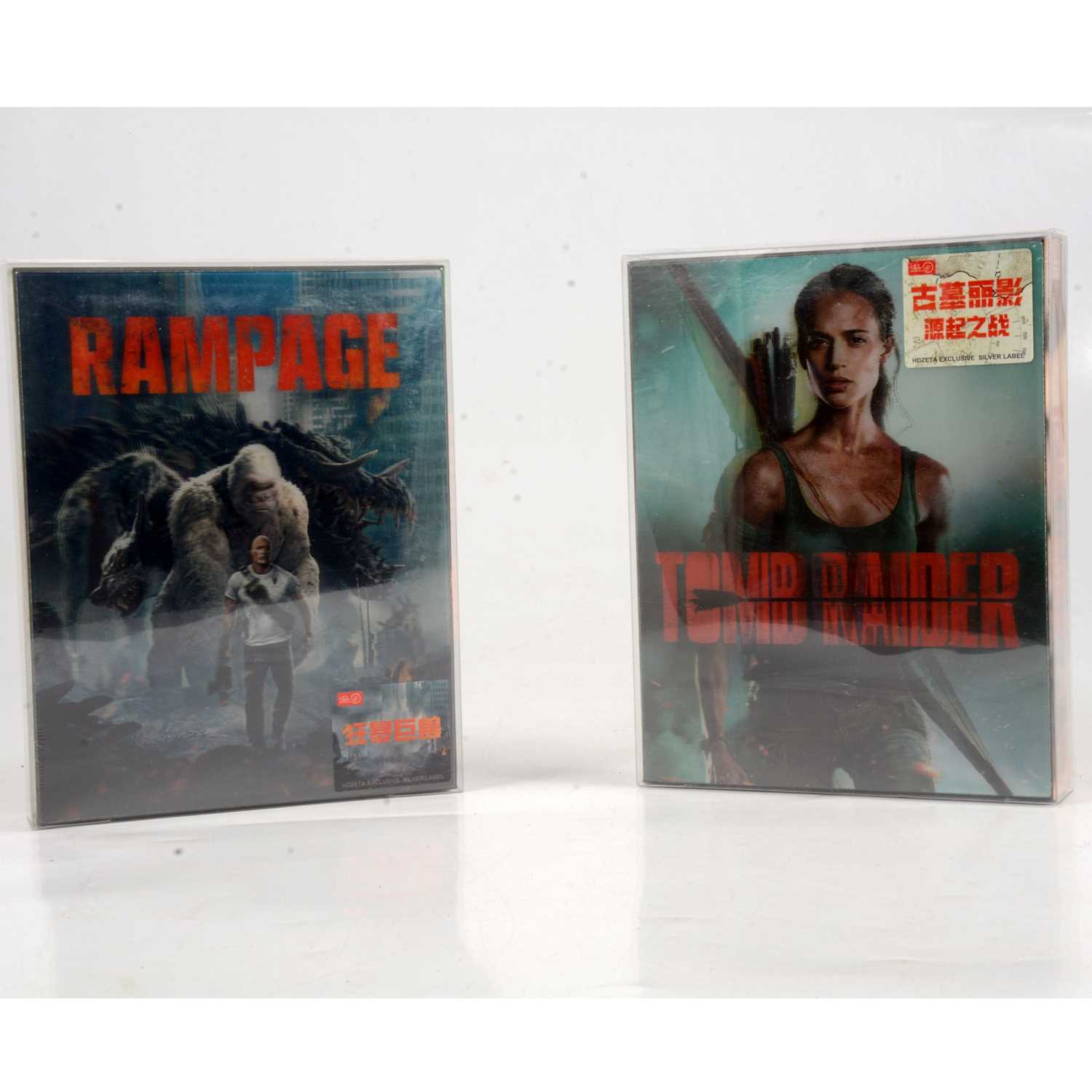 Lot 481 - Two Hdzeta Silver Label Steelbook Lenticular 3D Blu-rays, Tomb Raider and Rampage