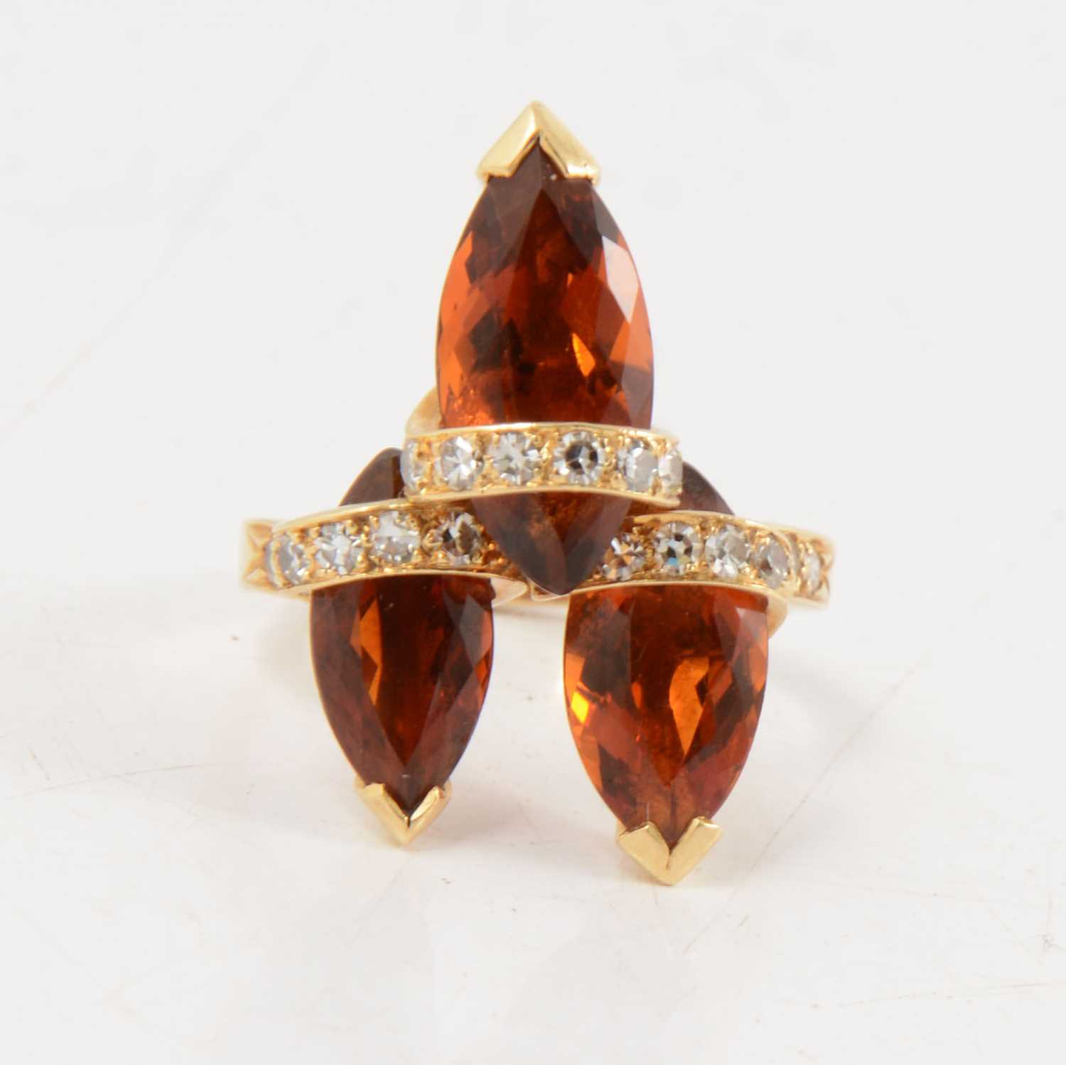 Lot 92 - Andrew Grima - an 18 carat gold diamond and gemset ring.