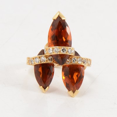 Lot 92 - Andrew Grima - an 18 carat gold diamond and gemset ring.