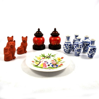 Lot 56 - Three terracotta seated cats, five small blue and white double gourd vases