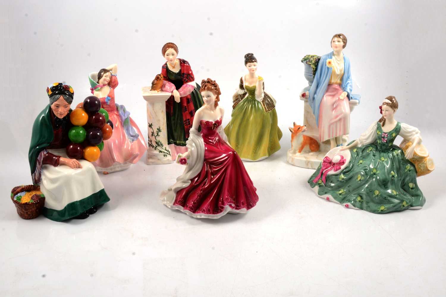 Lot 32 - Seven Royal Doulton and Royal Worcester figurines.