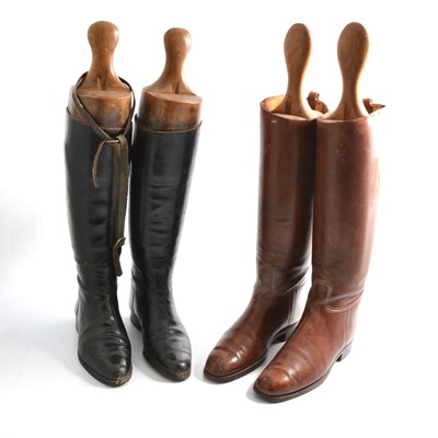Lot 208 - Two pairs of riding boots with trees, one pair black and one pair brown.