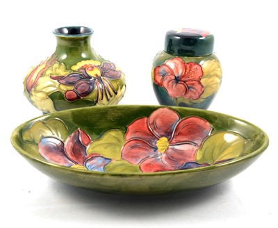 Lot 51 - Moorcroft Pottery Clematis bowl, Columbine squat vase and Hibiscus lidded ginger jar.