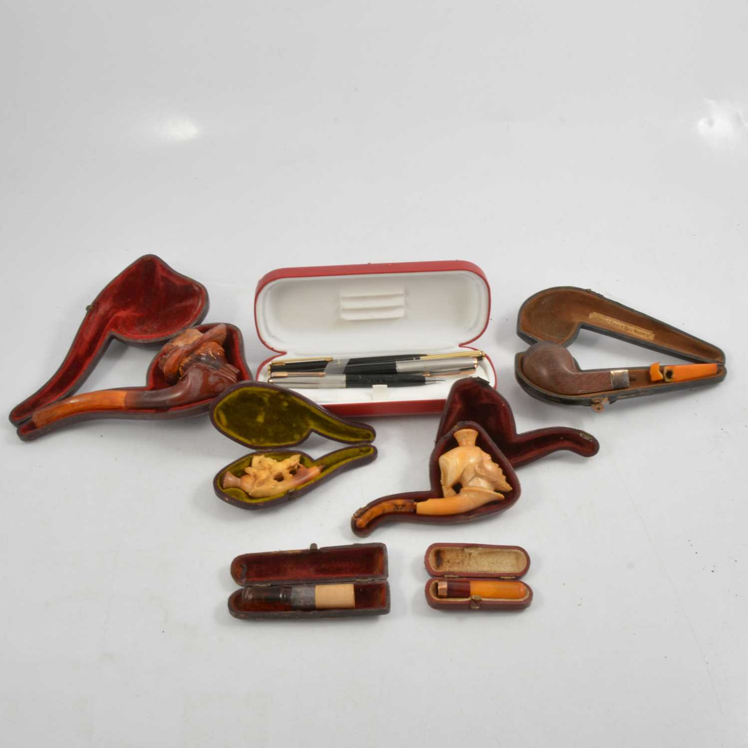 Lot 204 - Four cased carved meerschaum pipes, two cased cheroots, and Parker and other brand pens.