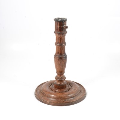 Lot 111 - Old oak candlestick.